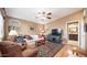 Living room with hardwood floors, sofa, and view into bathroom at 361 Felspar Dr, Apache Junction, AZ 85119