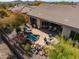 Beautiful backyard featuring desert landscaping, a refreshing pool, and comfortable patio seating at 41515 N Laurel Valley Way, Anthem, AZ 85086
