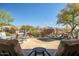 An outdoor living space with a waterfall pool, patio, and mountain views at 41515 N Laurel Valley Way, Anthem, AZ 85086