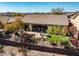 Inviting backyard with desert landscaping, small pool, and patio seating area at 41515 N Laurel Valley Way, Anthem, AZ 85086