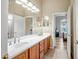 Bathroom featuring double sinks and a door leading to the Primary bedroom at 41515 N Laurel Valley Way, Anthem, AZ 85086