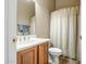 Cozy bathroom with neutral tones, a single sink vanity and shower-tub combo at 41515 N Laurel Valley Way, Anthem, AZ 85086