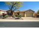 Charming single-story home with a three-car garage and well-maintained desert landscaping at 41515 N Laurel Valley Way, Anthem, AZ 85086