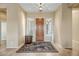 Spacious foyer with tile flooring, a decorative rug, and a grand front door at 41515 N Laurel Valley Way, Anthem, AZ 85086