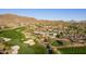 Aerial shot of the golf course and country club showing the lush green fairways and desert landscape at 41515 N Laurel Valley Way, Anthem, AZ 85086