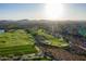 Beautiful aerial view of the golf course on a sunny day with mountains in the background at 41515 N Laurel Valley Way, Anthem, AZ 85086