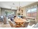 Well-lit dining and living area featuring tile floors, comfortable seating, and large windows at 41515 N Laurel Valley Way, Anthem, AZ 85086