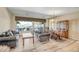 Spacious living room featuring wood floors, comfortable seating, and scenic views of the outdoor patio and mountains at 41515 N Laurel Valley Way, Anthem, AZ 85086