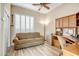 Bright office space featuring a comfortable couch and built-in desk area at 41515 N Laurel Valley Way, Anthem, AZ 85086