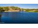 Picturesque water feature of a pond and small waterfall near the golf course, showcasing the beauty of the community at 41515 N Laurel Valley Way, Anthem, AZ 85086