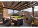Outdoor patio featuring a pergola, fireplace, seating, lush lawn, and a play area at 4415 E Weaver Rd, Phoenix, AZ 85050