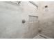 Beautiful walk-in shower with light gray tile, mosaic accent, and a built-in niche at 4415 E Weaver Rd, Phoenix, AZ 85050