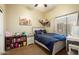 Comfortable bedroom featuring a cozy hammock filled with stuffed animals and a queen bed at 4415 E Weaver Rd, Phoenix, AZ 85050