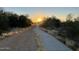 Scenic walking path surrounded by lush desert vegetation, ideal for an active outdoor lifestyle during twilight at 4415 E Weaver Rd, Phoenix, AZ 85050