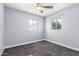 Well-lit bedroom with ceiling fan and two windows at 4425 E Glenrosa Ave, Phoenix, AZ 85018