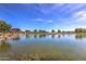 Scenic community lake with a wooden gazebo and lush landscaping at 4845 S Ferric --, Mesa, AZ 85212