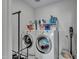 Bright laundry room with washer, dryer, and shelving at 4845 S Ferric --, Mesa, AZ 85212