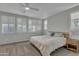 Main bedroom with king-size bed, nightstand, and ceiling fan at 4845 S Ferric --, Mesa, AZ 85212