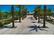 Community walkway lined with palm trees and shade structures at 4845 S Ferric --, Mesa, AZ 85212