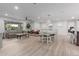 Spacious living area featuring wood-look flooring, modern furniture, and natural light at 5112 E Voltaire Ave, Scottsdale, AZ 85254