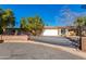 House exterior featuring a gated driveway and landscaping at 5616 E Argyle Dr, Phoenix, AZ 85018