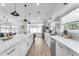 Open concept kitchen with white cabinets and a large island at 6201 E Carolina Dr, Scottsdale, AZ 85254