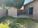 A well-kept backyard with a storage shed, grassy lawn, brick trim, and rock landscaping at 6604 W Evans Dr, Glendale, AZ 85306