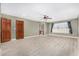 Expansive bedroom with wood flooring, ceiling fan, ensuite bathroom, and plentiful natural light at 6604 W Evans Dr, Glendale, AZ 85306