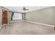 Spacious bedroom featuring light wood flooring, a ceiling fan, and a large window at 6604 W Evans Dr, Glendale, AZ 85306