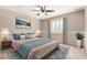Comfortable bedroom with a plush bed, stylish decor, and ample natural light at 6604 W Evans Dr, Glendale, AZ 85306