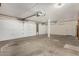 Spacious garage with white walls and multiple garage doors, providing ample parking and storage at 6604 W Evans Dr, Glendale, AZ 85306