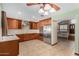 Spacious kitchen featuring stainless steel appliances and wood cabinets at 6604 W Evans Dr, Glendale, AZ 85306