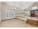 Bright and airy living room with tile flooring and staircase at 6604 W Evans Dr, Glendale, AZ 85306