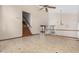 Spacious room featuring tile flooring and a staircase leading upstairs at 6604 W Evans Dr, Glendale, AZ 85306