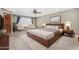 Spacious main bedroom features stylish furnishings, a ceiling fan, and a bright window at 6604 W Evans Dr, Glendale, AZ 85306