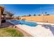 Backyard showcasing a private pool with a diving board, complemented by desert landscaping at 6604 W Evans Dr, Glendale, AZ 85306