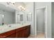 Bathroom with double sinks, large mirror and views to toilet room and shower at 6605 N 93Rd Ave # 1101, Glendale, AZ 85305