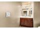 Cozy bathroom with vanity and sink, light fixtures and a view into the toilet and shower at 6605 N 93Rd Ave # 1101, Glendale, AZ 85305