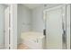 Well-lit bathroom featuring a soaking tub and a glass-enclosed shower at 6605 N 93Rd Ave # 1101, Glendale, AZ 85305