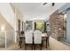 Bright dining area with elegant seating, a view to living area, and modern lighting at 6605 N 93Rd Ave # 1101, Glendale, AZ 85305