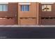 Exterior shot of three garages with unit numbers and a paved driveway at 6605 N 93Rd Ave # 1101, Glendale, AZ 85305