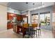 Bright kitchen boasts stainless appliances, bar seating, and large windows with community views at 6605 N 93Rd Ave # 1101, Glendale, AZ 85305