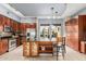 Well-lit kitchen is equipped with stainless appliances, eat-in island, and lots of cabinet storage at 6605 N 93Rd Ave # 1101, Glendale, AZ 85305