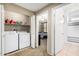 Laundry room with side-by-side washer and dryer, and access to the bedroom and bathroom at 6605 N 93Rd Ave # 1101, Glendale, AZ 85305