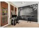 Office space with dark painted accent wall and decorative painted design and lighting at 6605 N 93Rd Ave # 1101, Glendale, AZ 85305