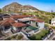 Luxury home featuring a pool, well-manicured lawn, and a stunning mountain view backdrop at 6825 N 39Th Pl, Paradise Valley, AZ 85253