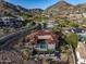 Sprawling estate with a red tile roof, sleek pool and landscaping nestled in the mountains at 6825 N 39Th Pl, Paradise Valley, AZ 85253