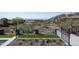 Backyard with artificial turf, desert landscaping, and black wrought iron fencing at 6825 N 39Th Pl, Paradise Valley, AZ 85253
