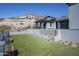 Exterior view showcasing the water feature and artificial turf in the backyard landscape at 6825 N 39Th Pl, Paradise Valley, AZ 85253