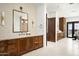 Luxurious bathroom with double vanities, elegant lighting, and stylish fixtures at 6825 N 39Th Pl, Paradise Valley, AZ 85253